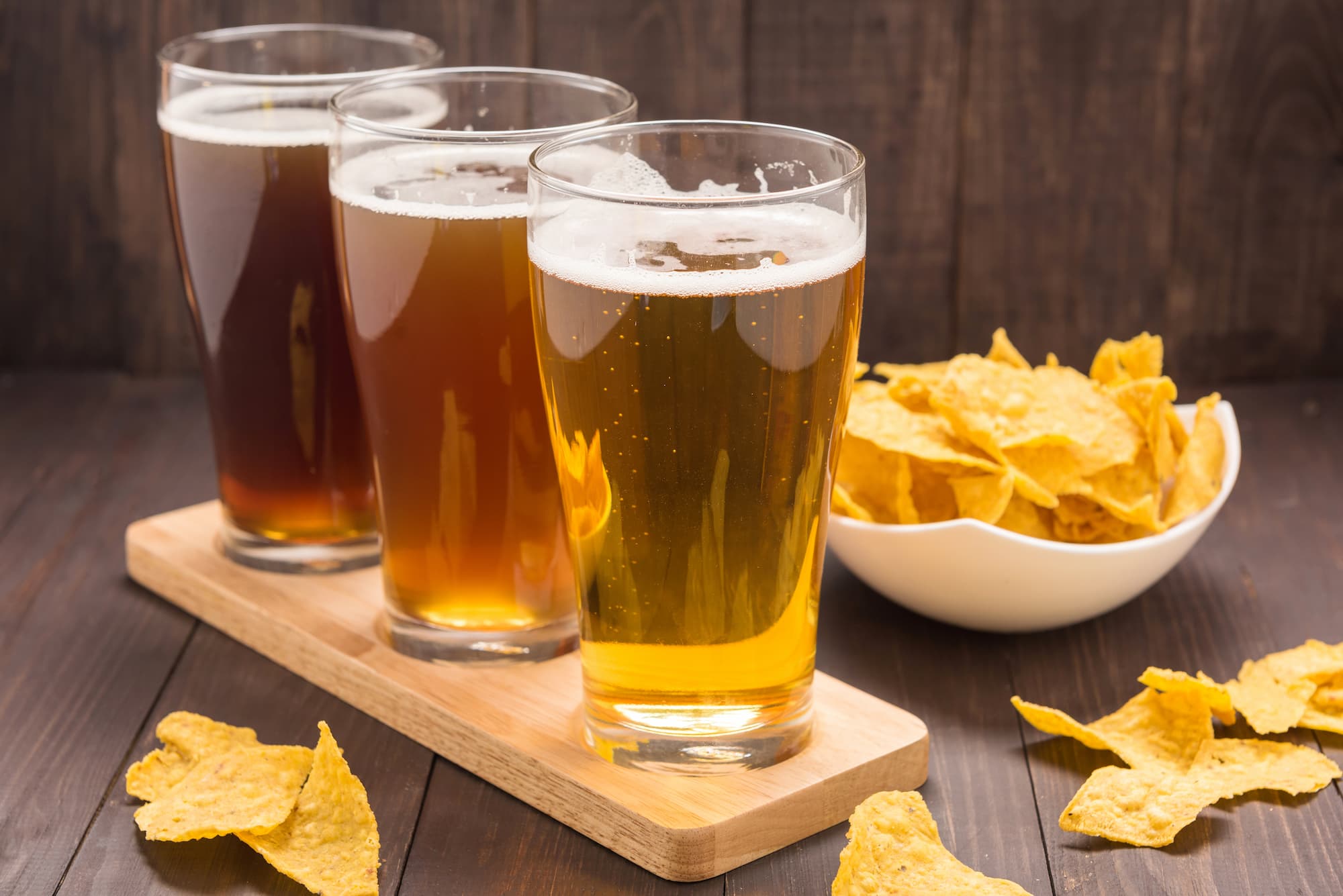 image of 3 different craft beers next to a bowl of fresh tortilla chips